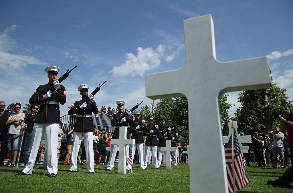U.S. Marines fire a volley of shots while standing among the graves of U.S. service members, most of them killed in the World War I Battle of Belleau Wood, during a ceremony to mark the 100th anniversary of the battle on Memorial Day at the Aisne-Marne American Cemetery on May 26, 2018, in France.