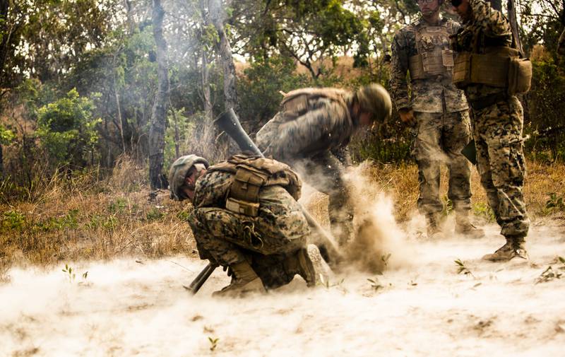 Marines with 3rd Battalion, 3rd Marine Regiment,  a part of Marine Rotational Force - Darwin, fire an M252 81mm extended range mortar system during a fire support coordination exercise at Mount Bundey Training Area, Australia, Aug. 9, 2019.
