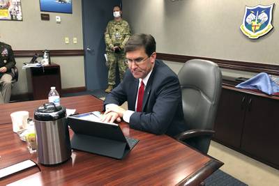 Defense Secretary Mark Esper speaks by video teleconference from U.S. Northern Command in Colorado Springs, Colo., on Thursday, May 7, 2020, with military medical specialists at civilian hospitals in New York and Connecticut.