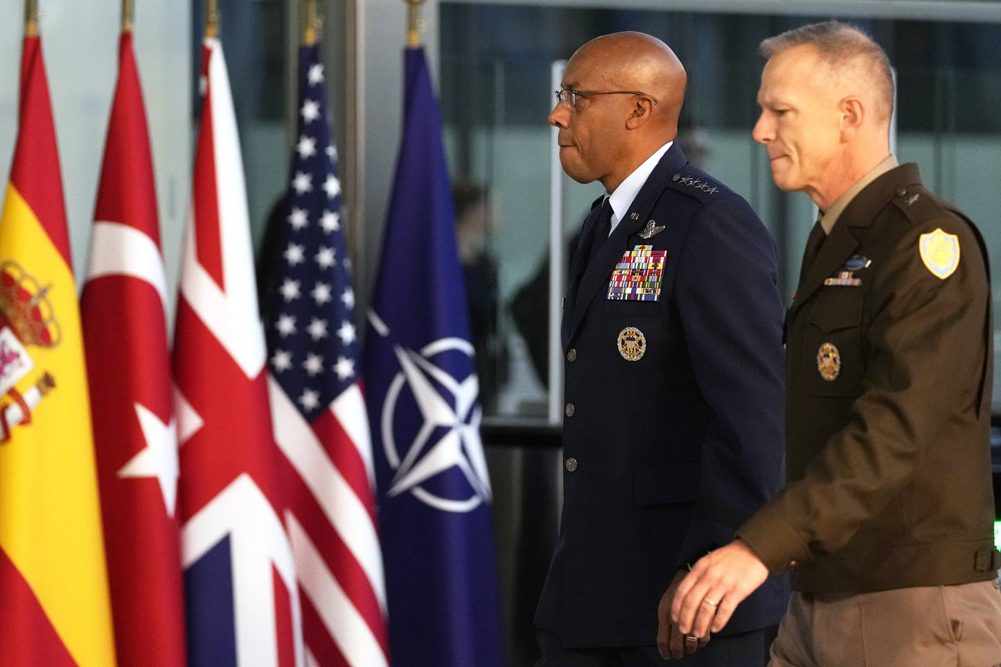 Chairman of the Joint Chiefs of Staff, U.S. Air Force Gen. CQ Brown, center, arrives for a meeting of NATO defense ministers at NATO headquarters in Brussels, Wednesday, Oct. 11, 2023.