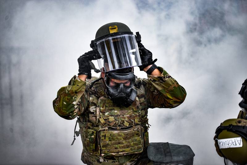 Tech. Sgt. Estevan Jojola puts on his face shield during a training exercise in Albuquerque, N.M., Aug. 17, 2020.