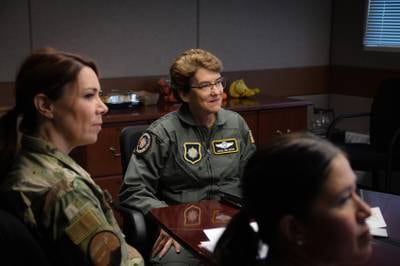 Air Force Gen. Jacqueline D. Van Ovost, commander, U.S. Transportation Command, listens to members of the 168th Wing while visiting Eielson Air Force Base, Alaska, May 18, 2022.