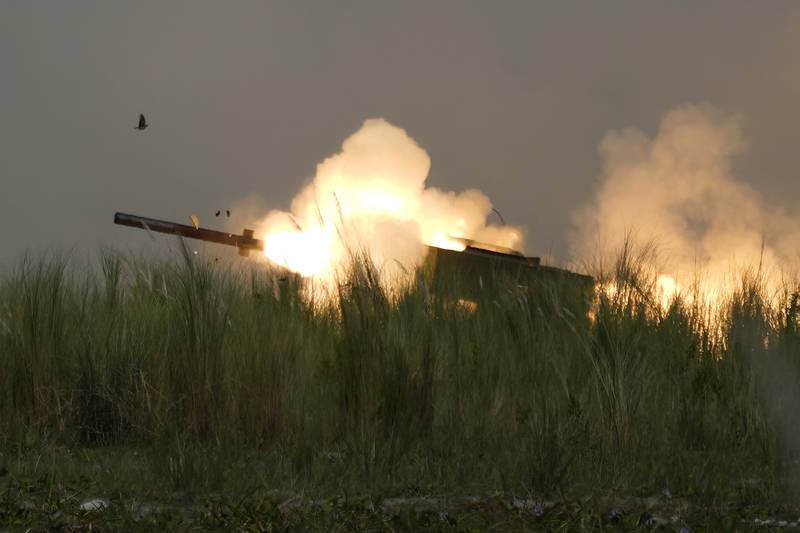 A U.S. M142 High Mobility Artillery Rocket System, or HIMARS, fires a missile during annual combat drills between the Philippine Marine Corps and U.S. Marine Corps in Capas, Tarlac province, northern Philippines, Thursday, Oct. 13, 2022.