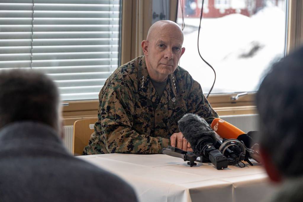 General David Berger seated at a table during a press conference