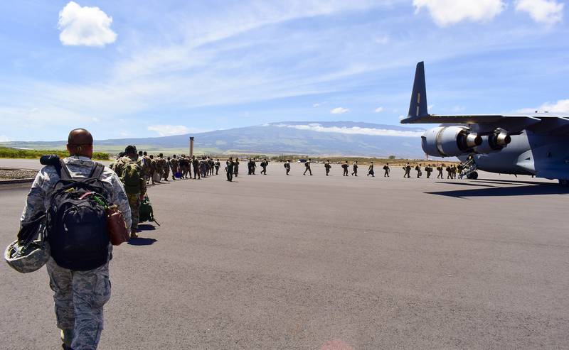 Members of the Hawaii National Guard board an aircraft home after volunteering to assist Maui County with supporting various tasks during COVID-19 operations, Kahului, Hawaii, May 28, 2020.