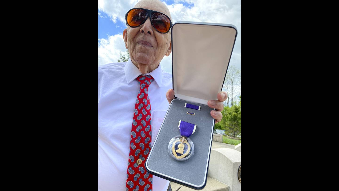 Marcos Montano, of Waukegan, Ill., shows off his replacement Purple Heart medal in Waukegan on May 30, 2020.