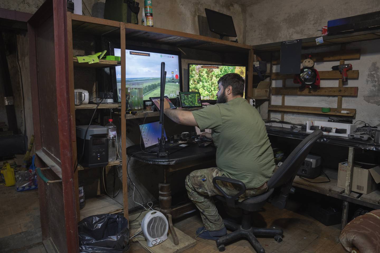 A Ukrainian officer works in his battalion headquarters on the frontline near Bakhmut, Donetsk region, Ukraine, Monday, May 29, 2023.