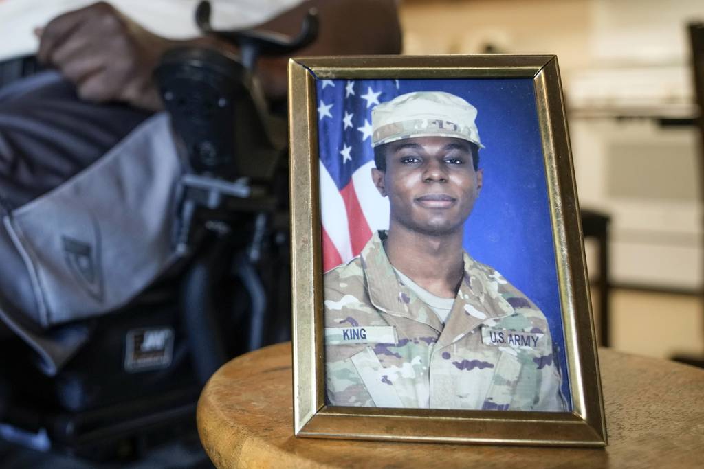 A portrait of American soldier Travis King is displayed as his grandfather, Carl Gates, talks about his grandson on July 19, 2023, in Kenosha, Wis.
