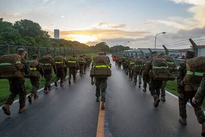 Marines participate in a 10 kilometer hike on Camp Hansen, Okinawa, Japan, July 12, 2019.