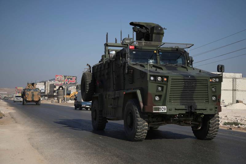A Turkish army convoy drives along the Bab al-Hawa highway on Aug. 24, 2019, on its way to reinforce a Turkish military observation point in northwestern Syria.