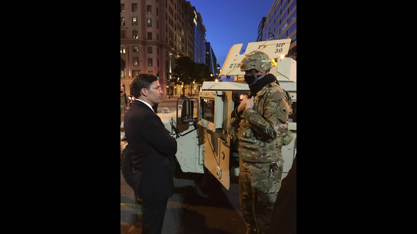 Defense Secretary Mark Esper greets D.C. National Guard troops hours after visiting St. John’s Episcopal Church with President Donald Trump, Chairman of the Joint Chiefs of Staff Army Gen. Mark Milley and other leaders.