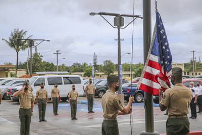 U.S. Marines assigned to Marine Corps Base (MCB) Camp Blaz conduct the first flag raising of the new command, marking the initial operation capability of the base in Dededo, Guam, Oct. 1, 2020.