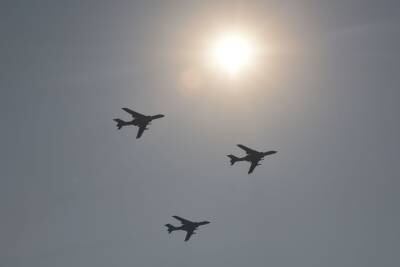 A formation of military H-6K bombers fly over Beijing during a military parade at Tiananmen Square on October 1, 2019, to mark the 70th anniversary of the founding of the People's Republic of China.