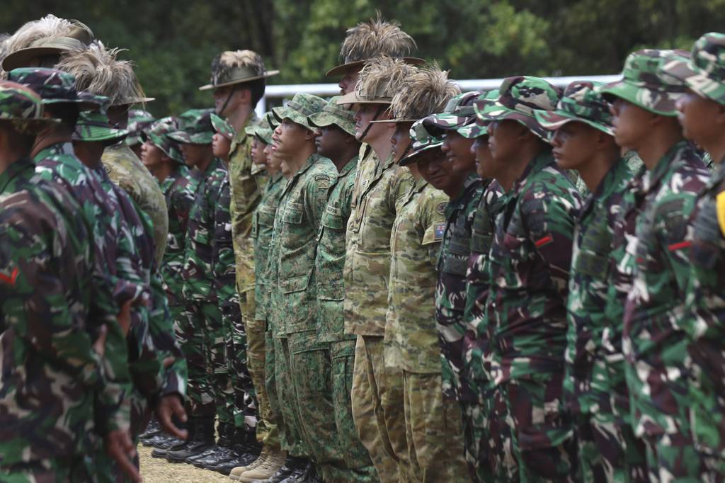 Indonesian, Singaporean and Australian Army soldiers attend the opening ceremony of Super Garuda Shield 2023 in Baluran, East Java, Indonesia, Thursday, Aug. 31, 2023.
