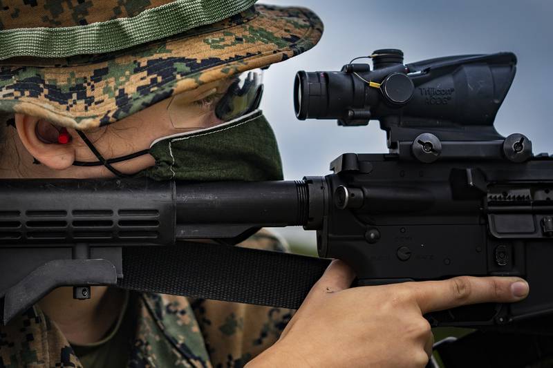 Marine Corps Lance Cpl. Faith Rose sights in on her target on Camp Hansen, Okinawa, Japan, May 6, 2020. Despite the outbreak of COVID-19, rifle ranges are still operating and enabling Marines to complete their yearly qualifications.