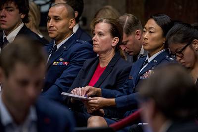Former aide Army Col. Kathryn Spletstoser sits in the audience as Gen. John Hyten appears before the Senate Armed Services Committee on Capitol Hill in Washington, Tuesday, July 30, 2019, for his confirmation hearing to be vice chairman of the Joint Chiefs of Staff.