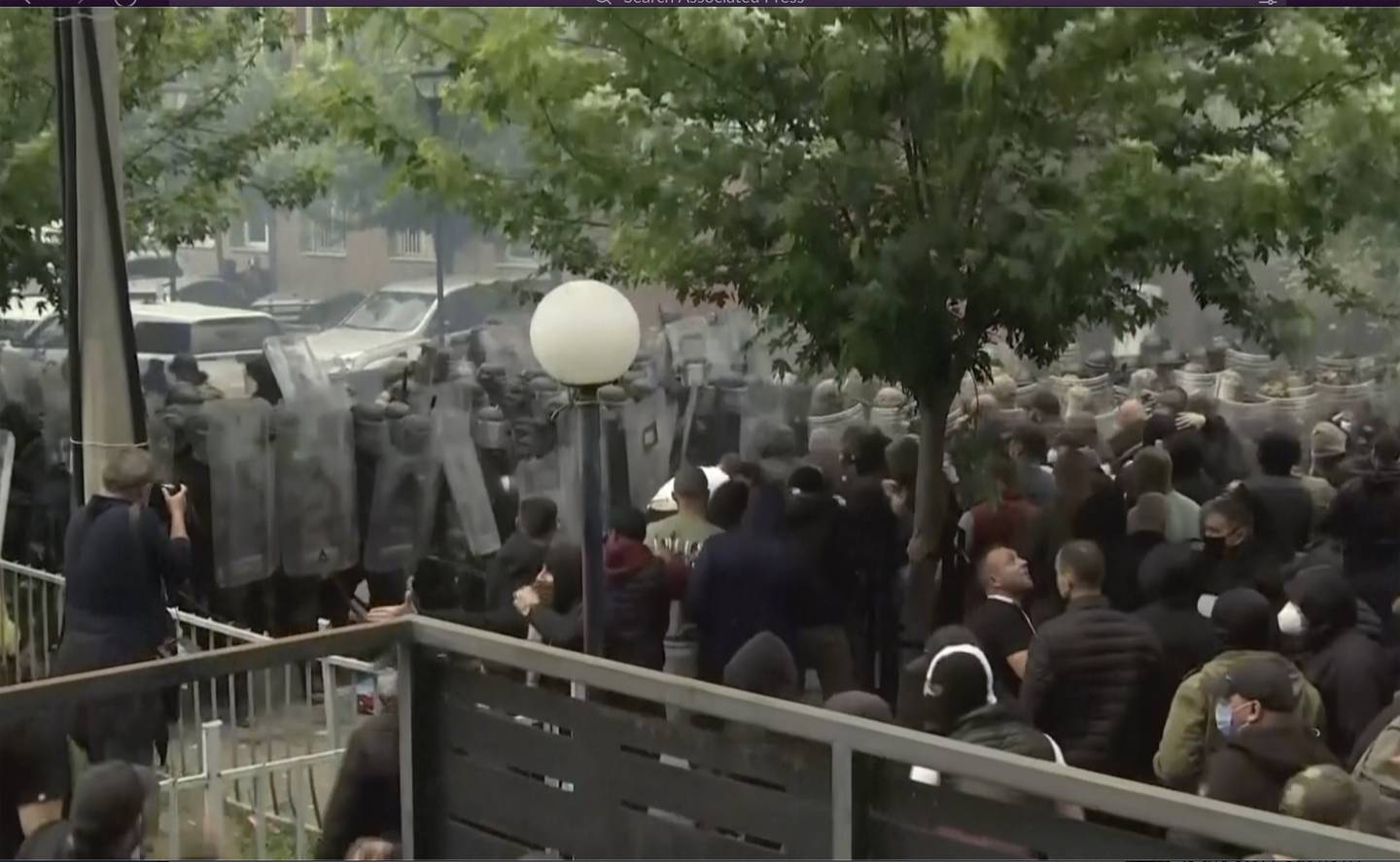 In this grab taken from video, KFOR soldiers guard a municipal building after clashes with Kosovo Serbs in the town of Zvecan, northern Kosovo, Monday, May 29, 2023.
