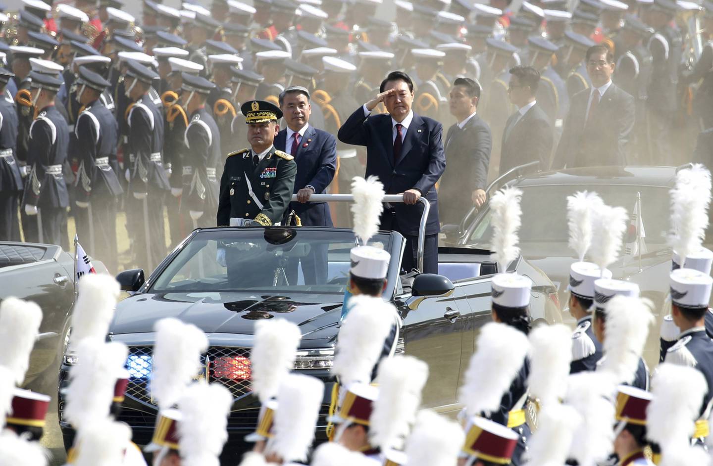 South Korean President Yoon Suk Yeol salutes as he inspects honor guard during the 74th anniversary of Armed Forces Day at the Gyeryong military headquarters in Gyeryong, South Korea, Saturday, Oct. 1, 2022.