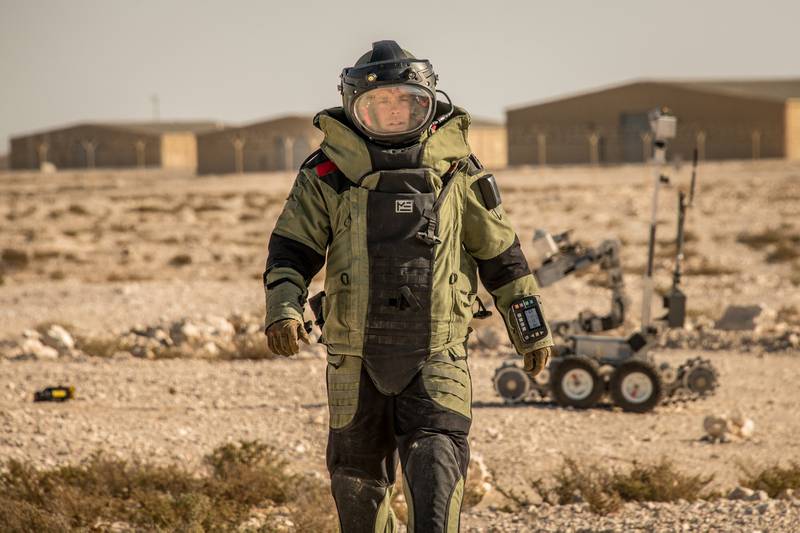 Tech. Sgt. Brook A. Hamilton, 379th Expeditionary Civil Engineer Squadron noncommissioned officer in charge of explosive ordnance disposal training, places an XRS-150 X-ray in front of a simulated downed unmanned aerial system during an exercise at Al Udeid Air Base, Qatar, Jan. 20, 2021.