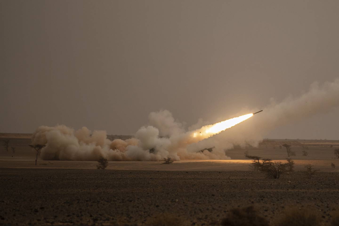 A launch truck fires the High Mobility Artillery Rocket System (HIMARS) at its intended target during the African Lion military exercise in Grier Labouihi complex, southern Morocco, on June 9, 2021.