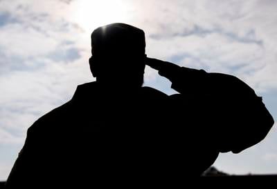 An airman renders a salute at Royal Air Force Alconbury, England, Oct. 19, 2021.