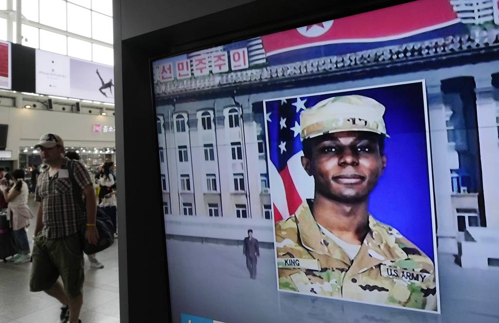 A TV screen shows a file image of American soldier Travis King during a news program at the Seoul Railway Station in Seoul, South Korea on Aug. 16, 2023.