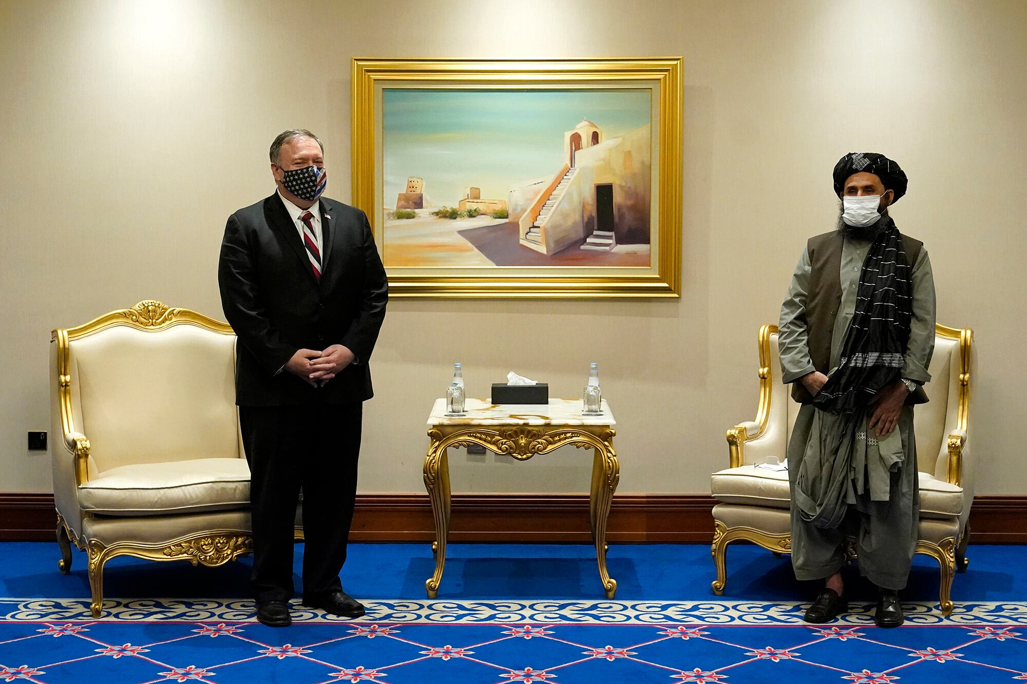 Secretary of State Mike Pompeo meets with Mullah Abdul Ghani Baradar, head of the Taliban's peace negotiation team, amid talks between the Taliban and the Afghan government, Saturday, Nov. 21, 2020, in Doha, Qatar.