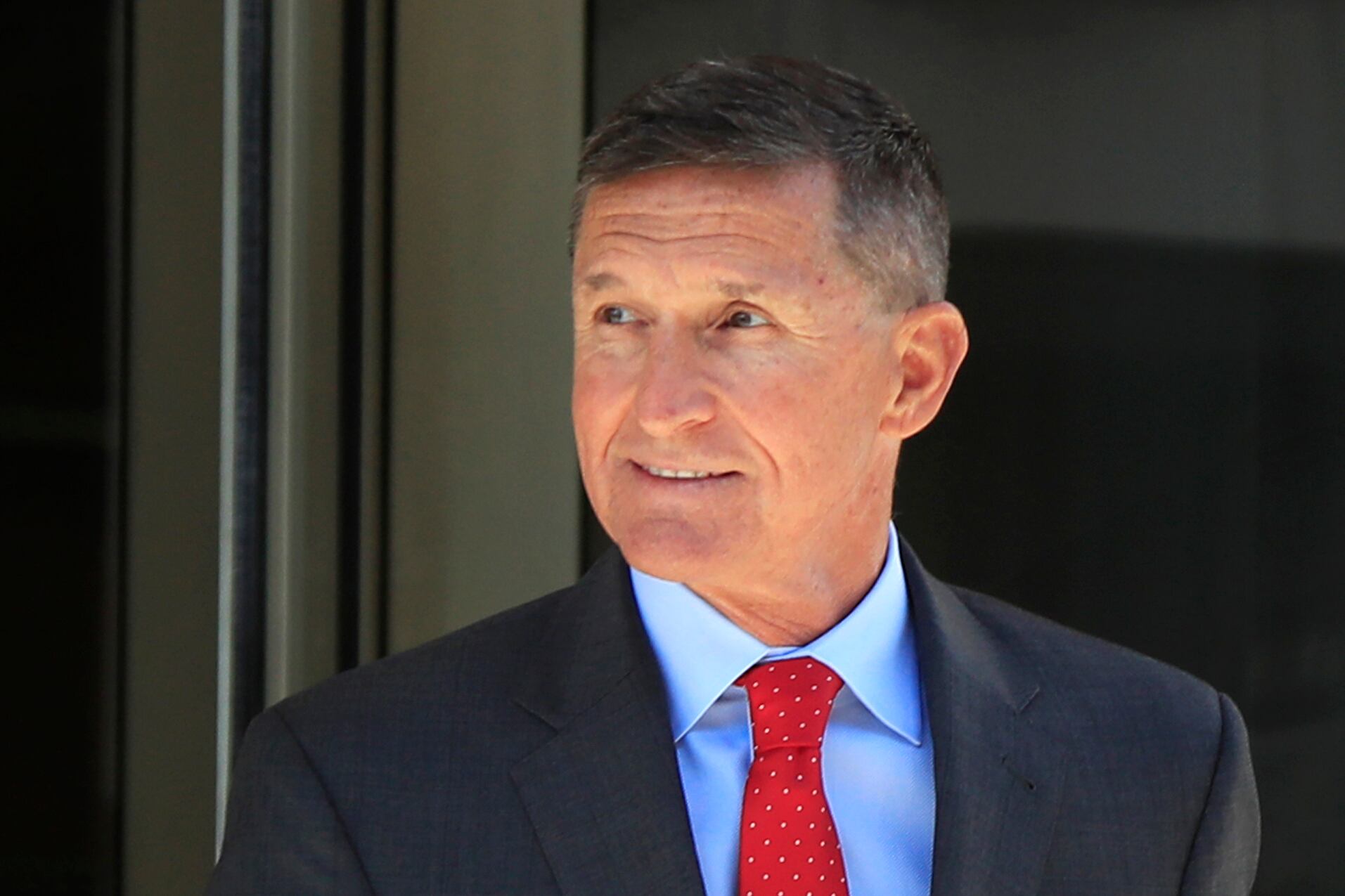 former Trump national security adviser Michael Flynn leaves the federal courthouse in Washington, following a status hearing.