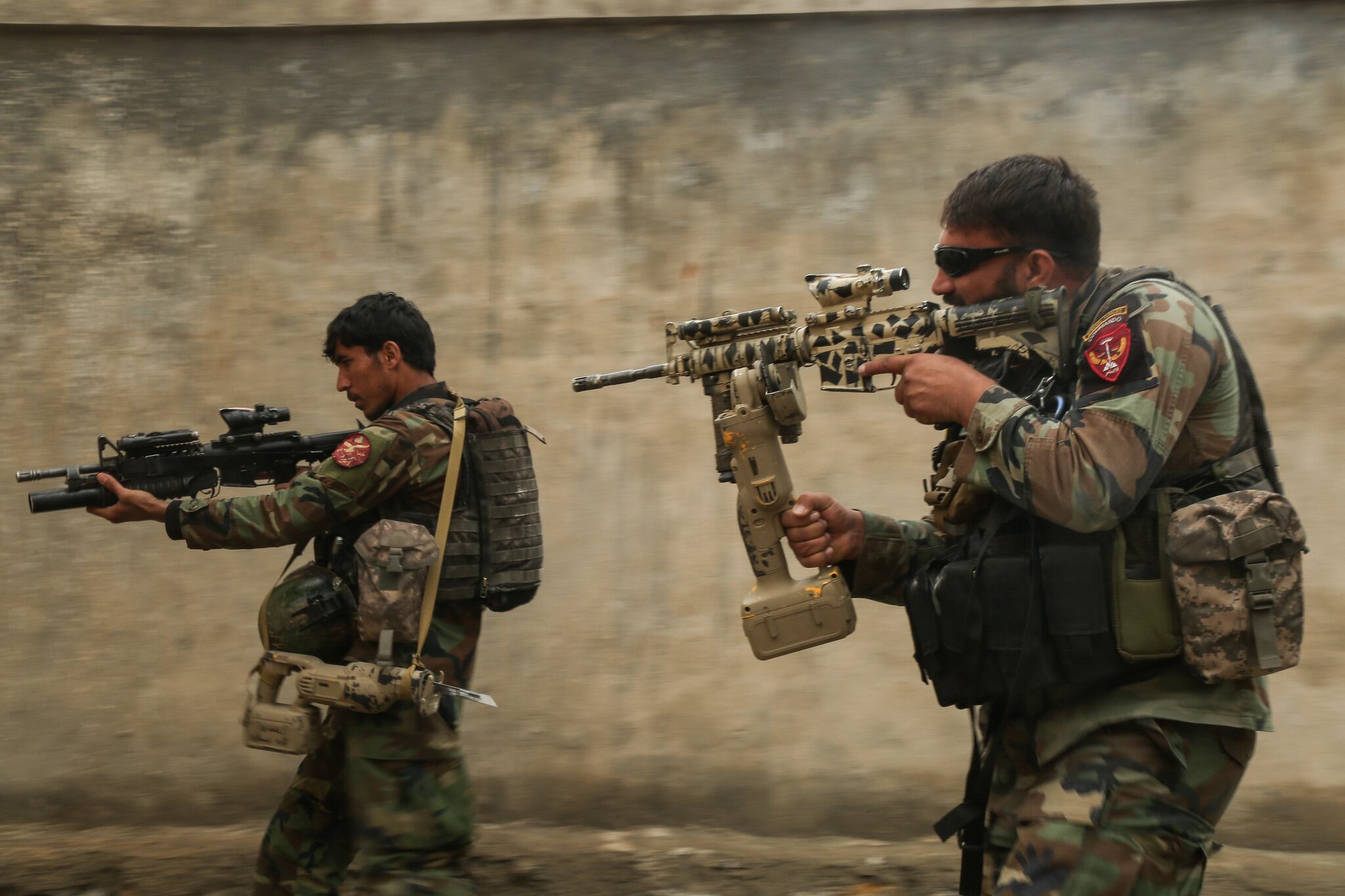 Commandos assigned to 1st Special Operations Kandak clear a training compound during breaching training in Laghman province, Afghanistan, Feb. 13, 2018.