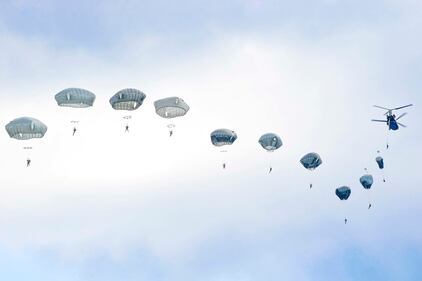 U.S. Army paratroopers execute an airborne proficiency jump from a CH-47 Chinook helicopter onto Bunker Drop Zone in Grafenwoehr Training Area, Germany, Aug. 14, 2019.