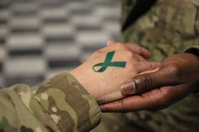 A temporary teal ribbon tattoo is seen on a soldier's hand at Bagram Airfield in Afghanistan on April 2, 2014.