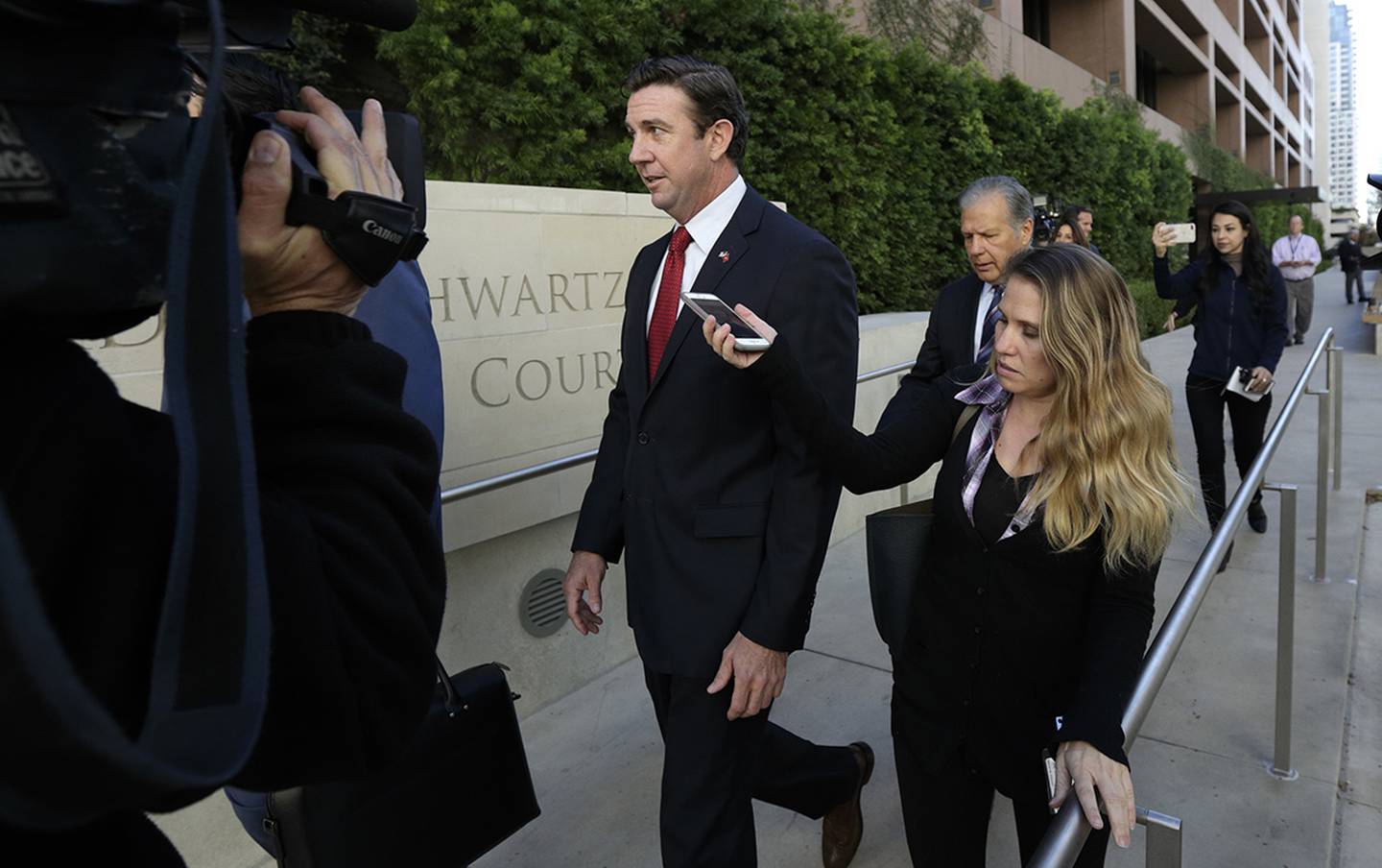 Rep. Duncan Hunter  leaves court in San Diego.