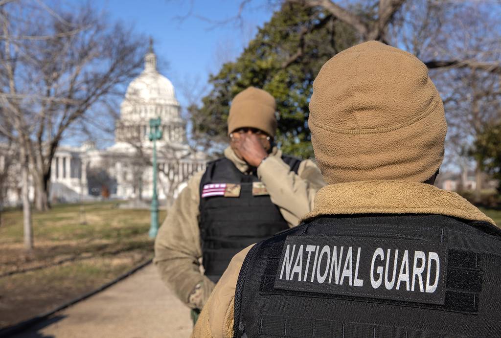 D.C. National Guard Guardsmen stand outside the U.S. Capitol on Jan. 7, 2021, in Washington.